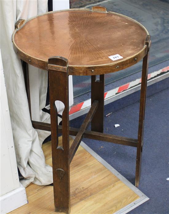 An Arts & Crafts circular copper top oak occasional table, Diam.52cm